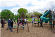 Kids and parents playing on the Perry Park Playground