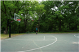 A Black Man plays basketball at Hazelnut Park Basketball Court