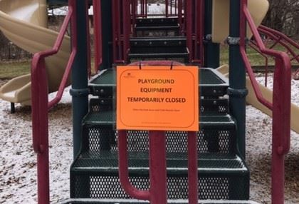 Playground Closed sign on playground equipment