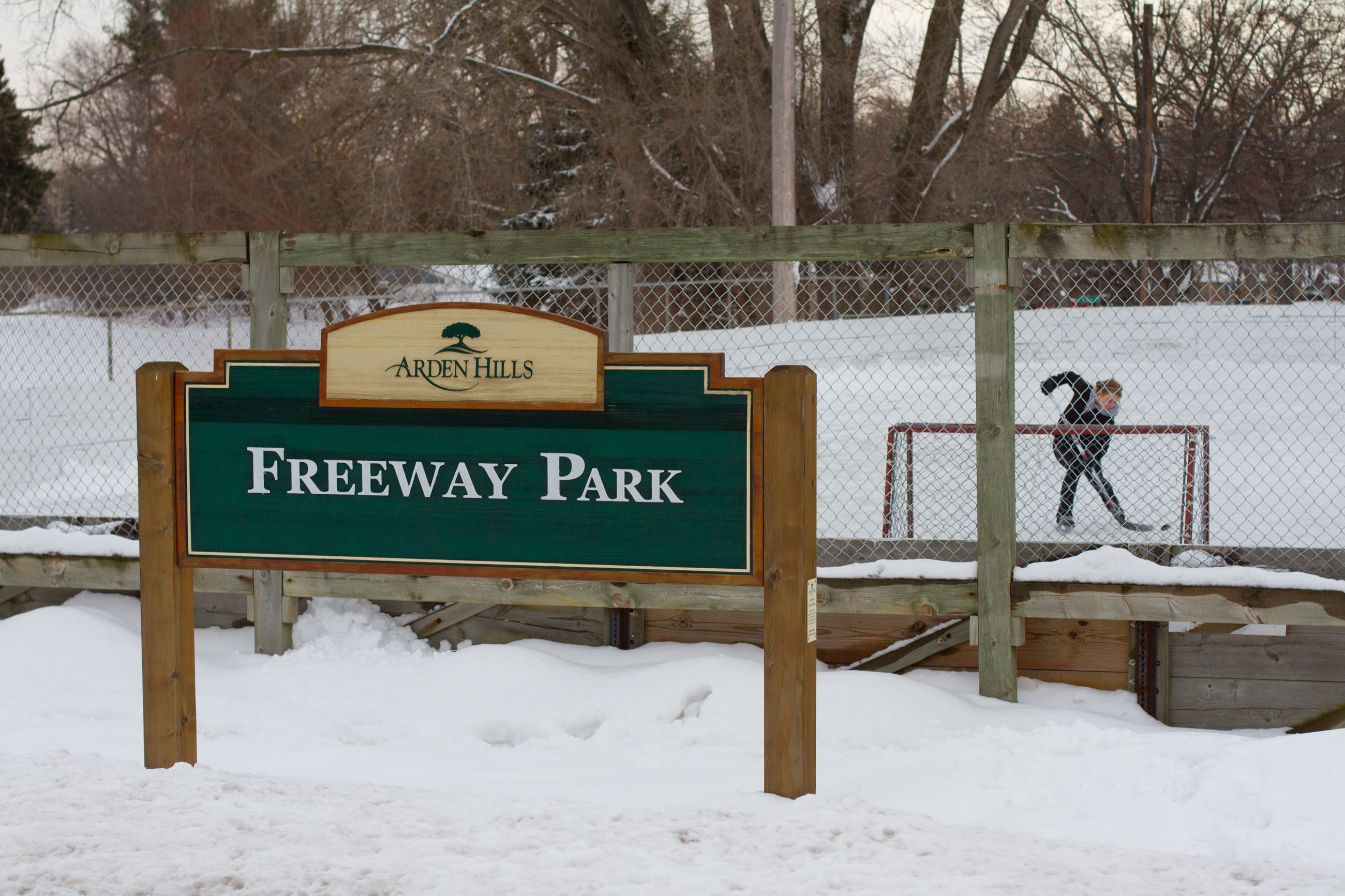 Freeway park hockey rink with femme skater on the ice