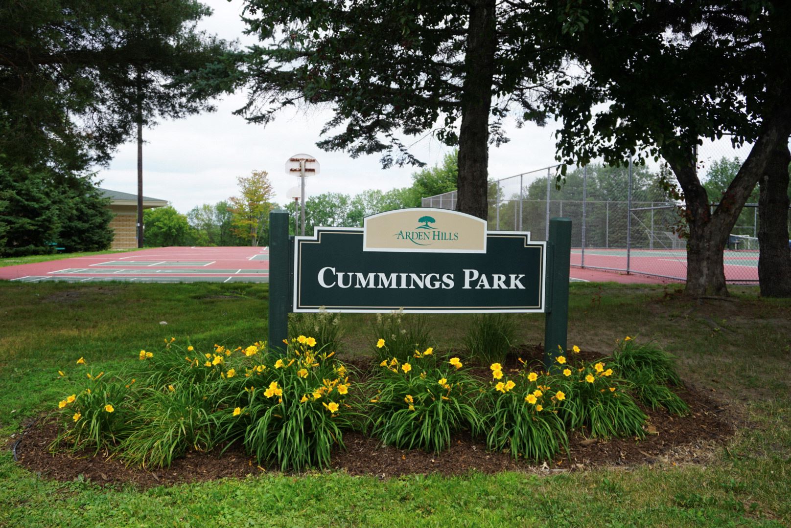 Cummings Park Sign surrounded by plants