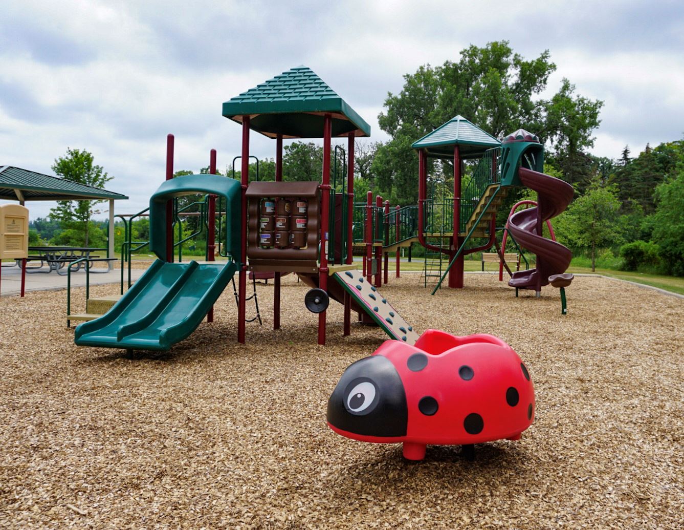 Valentine Hills Park Playground Equipment with Ladybug-shaped Toy- Landscape orientation